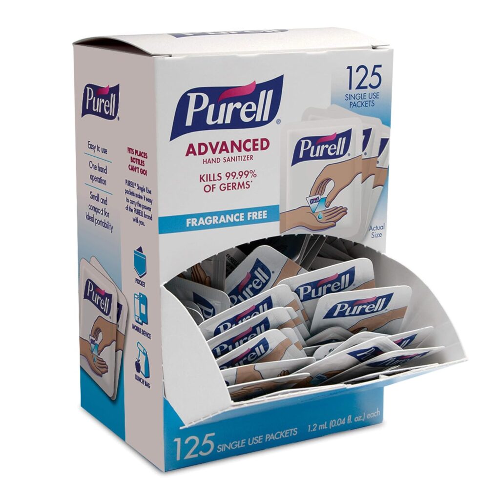 A box of Purell Advanced hand sanitizer single-use packets, labeled as fragrance free and kills 99.99% of germs. The box contains 125 packets, with several visible in the open front.