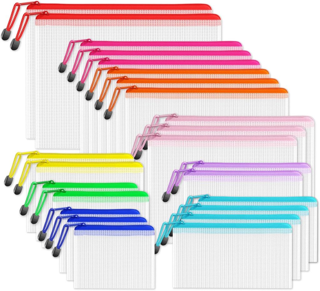 A set of 24 translucent mesh zipper pouches in six colors—red, orange, yellow, green, blue, and pink—arranged in groups by color, each pouch with a colored zipper and matching wrist strap.
