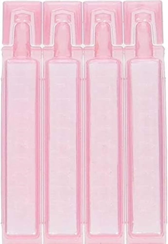 Four pink, rectangular plastic ampoules are arranged side by side. Each ampoule has a rounded tip at the top for dispensing liquid. The containers are transparent and appear empty.